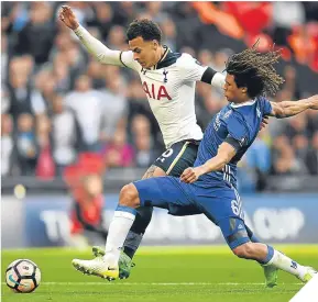  ??  ?? Dele Alli of Tottenham Hotspur takes on Chelsea’s Nathan Ake.