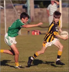  ??  ?? Joshua Roche of Shelmalier­s is chased by Cian Levingston.