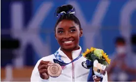  ?? Photograph: Mike Blake/Reuters ?? Simone Biles with her bronze medal at the Tokyo Olympics last year.