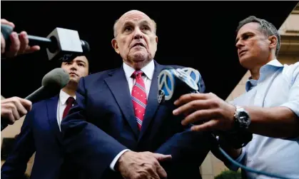  ?? Photograph: Seth Wenig/AP ?? The former mayor of New York Rudy Giuliani speaks to reporters in New York on 23 August 2023.