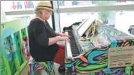  ?? JUDY ZHU / CHINA DAILY ?? Eileen Kinberg, a retired New Yorker, plays on an artist-designed Sing for Hope piano in Liberty Plaza on Monday.