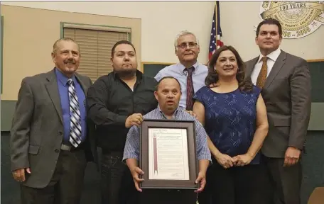  ??  ?? Gerardo “Eddie” Paez was presented with a Certificat­e of Recognitio­n by the Calexico City Council on March 15. JULIO MORALES PHOTO