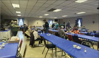  ?? LISA SCHEID — READING EAGLE ?? After a year away due to the pandemic, patrons returned to sit-down meals for the traditiona­l pork and sauerkraut fundraiser at Ruscombman­or Volunteer Fire Company on New Year’s Day 2022.