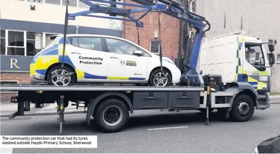  ??  ?? The community protection car that had its tyres slashed outside Haydn Primary School, Sherwood