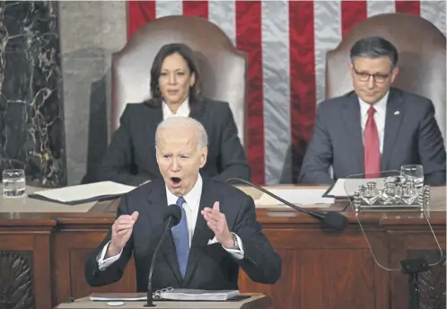  ?? ?? A fiesty US president Joe Biden delivers his State of the Union address in the House Chamber of the US Capitol in Washington watched by vice-president Kamala Harris and House, Speaker Mike Johnson