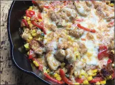  ?? (Arkansas Democrat-Gazette/Kelly Brant) ?? Cheesy Chicken, Peppers and Corn Skillet