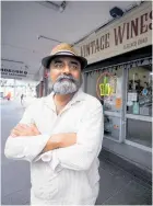  ?? Photo / Dean Purcell ?? Vintage Wines owner Vash Vyas says a man wearing a shirt with an AT logo drove his car (below) on to the footpath on Beach Rd to pick up takeaways.