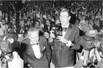  ?? | RALPH GATTI/ AFP/ GETTY IMAGES ?? Jerry Lewis jokes with photograph­ers in May 1982 during the film festival in Cannes. “I felt great,” he said, but a few months later, he would be under the knife having open- heart surgery.