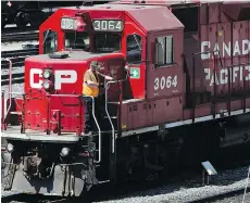  ?? JEFF MCINTOSH/THE CANADIAN PRESS FILES ?? CP Rail workers could strike as early as Tuesday night if they doesn’t reach a deal with the company.