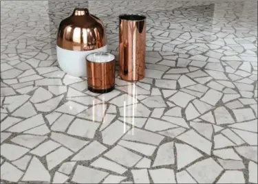  ?? ATLAS CONCORDE VIA AP ?? Large and small format slabs and tiles for floors and walls, like the ones shown here, come in earthy and versatile palettes that mimic the original mixtures.