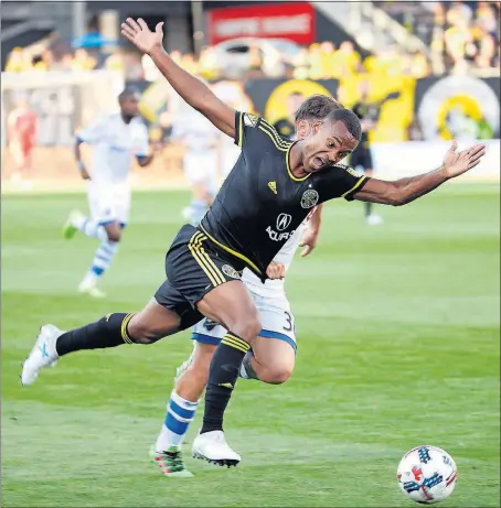  ?? [KYLE ROBERTSON/DISPATCH] ?? The Crew’s Ola Kamara gets fouled by the Impact’s Hernan Bernardell­o.