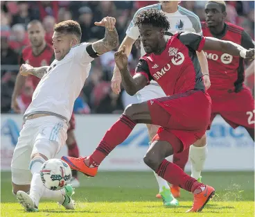  ?? CHRIS YOUNG / THE CANADIAN PRESS ?? Toronto FC Reds’ Tosaint Ricketts, right, has filled the offensive void for the MLS team with the injury to top scorer Sebastian Giovinco. The Reds take a six-game winning streak into their match Friday night against the New York Red Bulls in New Jersey.