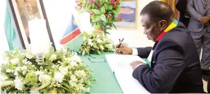  ?? – Picture Justin Mutenda ?? President Mnangagwa signs the Book of Condolence­s at the Namibian Embassy in Harare yesterday following the death of Namibian President Hage Geingob.