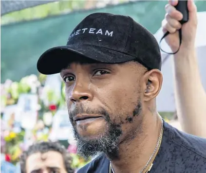  ?? CHRIS DAY/SOUTH FLORIDA SUN SENTINEL ?? Heat captain Udonis Haslem sheds a tear while answering questions after visiting a makeshift memorial at the site of the Surfside condo collapse on Wednesday.