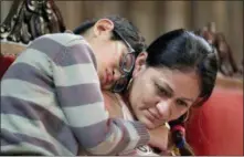  ?? SETH WENIG — THE ASSOCIATED PRESS ?? Daniel Sanchez, 10, hugs his mother Aura Hernandez during a service Thursday at the Fourth Universali­st Society in New York.