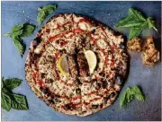  ?? COURTESY OF DREW AMANDOLIA ?? Atlanta native Matthew Foster wanted to create a pizza that pays tribute to local culture. His solution was to add lemon-pepper sauce and a couple of wet, lemon-pepper wing flats to a pizza.