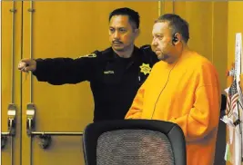  ?? Jeff Chiu ?? The Associated Press Andrew Warren, an Oxford University financial officer accused in the fatal stabbing of a Chicago man, enters a San Francisco courtroom Friday for an extraditio­n hearing.