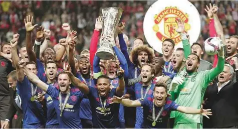  ?? AP ?? Manchester United’s Wayne Rooney lifts the trophy after winning the Europa League final against Ajax at the Friends Arena in Stockholm on Wednesday. United won 2-0.