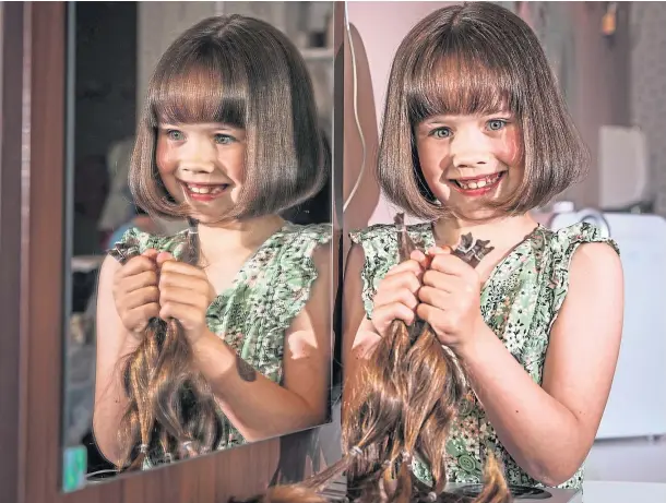  ??  ?? A WEE GEM: Taylor Strachan, 8, had her hair cut in aid of the Little Princess Trust which provides wigs to children suffering medical conditions.