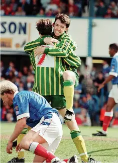  ?? ?? Albion players celebrate having avoided relegation at the end of the season