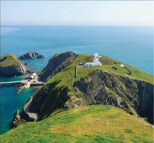  ??  ?? Clockwise from left: Lundy Island; Almaty, Kazakhstan; Simon Reeve and a San Bushman