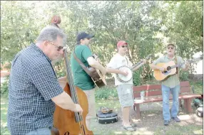  ?? LYNN KUTTER ENTERPRISE-LEADER ?? Porchlight Symphony performed in June for 2nd Saturday Trades Day. Other bands are scheduled to perform at the Aug. 12 event in downtown Prairie Grove. Live music will be going on in the lawn next to the Prairie Grove Chamber building.