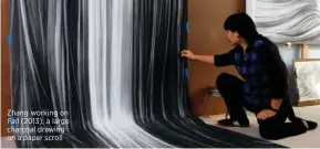  ??  ?? Zhang working on
Fall (2013), a large charcoal drawing on a paper scroll