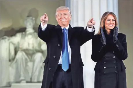  ?? EVAN VUCCI, AP ?? Donald Trump and his wife, Melania, arrive at a pre-inaugural celebratio­n at the Lincoln Memorial on Thursday.