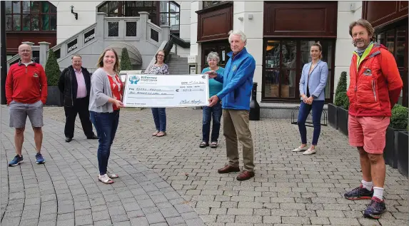  ?? Photo: Valerie O’Sullivan ?? Ain’t no mountain high enough… Rosie Healy, organiser, presenting a cheque of €4,015 to Pat Doolan, Chairman of Kerry Hospice Foundation, Killarney Branch. from the proceeds of the inaugural Winter Solstice Charity Hike on the Paps of Anú in December. At the cheque presentati­on were from left, organiser, Donie Mulcahy, Mountain Guide, Paul Sherry, President Killarney Chamber of Tourism and Commerce, Angela Curran, Kerry Hospice Foundation, Mary O’Donoghue, Landowner/organiser, Gemma Ring, Killarney Plaza Hotel, who hosted and donated very generously to the Coffee morning after the hike, and John O’Sullivan, organiser, Reeks Guiding Company.