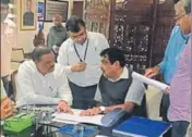  ?? HT PHOTO ?? BJP state chief Vijay Sampla presented a revised draft to Union transport minister Nitin Gadkari at a meeting in Jalandhar on Saturday.