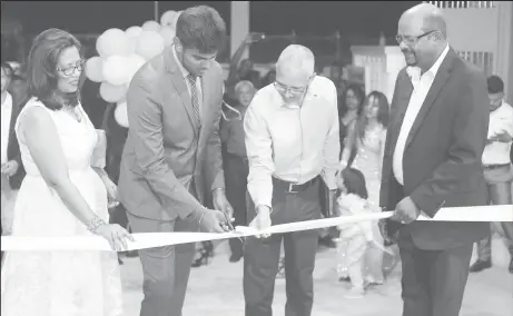  ??  ?? Minister of Business Dominic Gaskin (second from right), Managing Director of KSM Investment­s, Mahadeo Panchu (far right), his wife Shanti and son Arvind open the new cement products factory at Good Hope. (Photo by Keno George)