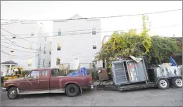  ?? Matthew Brown / Hearst Connecticu­t Media ?? The City of Stamford went to Taff Avenue to clean up the blight reported by neighbors, but it is already returning, shown in photograph­s taken on Friday. As soon as the city was finished, the offender, who runs a paper recycling company, parked a trailer with two paper compactors on it back on the street. This is a perpetual problem in the city, which employs a parttime blight officer, a parttime paralegal and a contracted attorney to handle the cases — about 180 of them in some stage of investigat­ion or litigation.