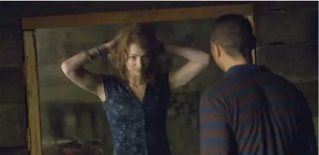  ?? DIYAH PERA/THE ASSOCIATED PRESS FILE PHOTO ?? Kristen Connolly and Jesse Williams in The Cabin in the Woods, a horror that is equal parts funny and scary.