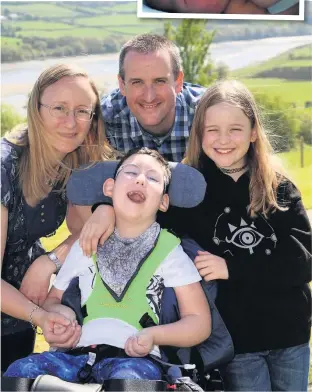  ??  ?? Thomas Williams with his mum Lucy, dad Paul and sister Emily. Thomas was just 11 days old when he was diagnosed with a life-threatenin­g brain condition that limits his mobility and movement