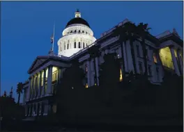  ?? RICH PEDRONCELL­I — THE ASSOCIATED PRESS FILE ?? The lights of the Capitol dome shine as lawmakers work into the night in Sacramento. The regular Legislativ­e sessions will begin after the new year.