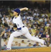  ??  ?? Los Angeles Dodgers starting pitcher Kenta Maeda, of Japan, throws to an Arizona Diamondbac­ks batter during the fourth inning, Friday, in Los Angeles.