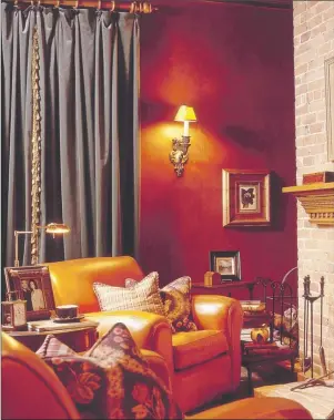  ??  ?? Polished faux leather walls, full length velvet drapes and comfy leather chairs produce an irresistib­le den or study.