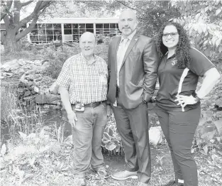  ?? PAUL MUSCHICK/THE MORNING CALL ?? An outdoor classroom is planned in the courtyard at Dieruff High School in Allentown, to supplement the pond and existing nature area. From left, Rob Bell, chairman of the Class of 1970 reunion committee; Principal Michael Makhoul; and science department chair Leila Little.