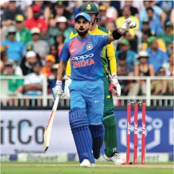  ??  ?? RUNNING THE SHOW: Virat Kohli issues instructio­ns to his batsman during the T20 match at the Wanderers yesterday.