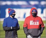  ?? Brett Carlsen / Associated Press ?? Bills offensive coordinato­r Brian Daboll, right, with team chaplain Len Vanden Bos on Nov. 29, would be a good candidate for the Jacksonvil­le job.