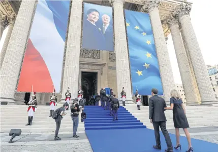  ?? PA ?? France’s President Emmanuel Macron, left, and his wife Brigitte Macron, right, follow Republican Guards carrying the coffins of former French politician and Holocaust survivor Simone Veil and her husband Antoine Veil to the Panthéon’s nave, during the burial ceremony in Paris.