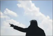  ?? ANDREW HARNIK ?? FILE - In this July 27, 2020, file photo President Donald Trump waves as he walks towards Marine One on the South Lawn of the White House in Washington. Trump is painting a dystopian portrait of what Joe Biden’s America might look like, asserting crime and chaos would ravage communitie­s should the former vice president win the White House in November. Left unmentione­d by Trump is that a recent surge in violent crime recently endured in several big American cities has come under his watch.