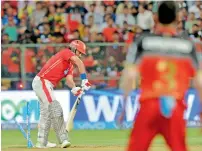  ?? AFP ?? Kings XI’s Yuvraj is bowled out during the match against RCB. Yuvraj scored 65 runs from six matches in the IPL 2018. —