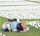  ?? PATRICK SEMANSKY/AP ?? White flags at the National Mall commemorat­ing the more than 700,000 Americans who died of COVID-19.