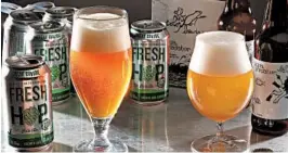  ?? MICHAEL TERCHA/CHICAGO TRIBUNE ?? Fresh-hop beers such as Great Divide Brewing Company’s Fresh Hop Pale Ale and Off Color Brewing’s Aqua Predator present special challenges for farmers and brewers.