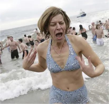  ?? SETH WENIG — THE ASSOCIATED PRESS ?? For more than 100 years, the Coney Island Polar Bear Club has been swimming in the Atlantic Ocean throughout the winter.