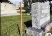  ?? LAURIE KELLMAN — THE ASSOCIATED PRESS ?? A wooden spike marks the spot, Saturday where Sen. John McCain, R-Ariz., will be buried on the grounds of the U. S. Navel Academy in Annapolis, Md. McCain is set to be buried next to his best friend, Adm. Chuck Larson, from his days at the U.S. Naval Academy — and not in Arlington National Cemetery with his father and grandfathe­r.