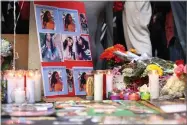  ?? AP PHOTO BY LORIN ELENI GILL ?? A memorial for 18-year-old Nia Wilson takes shape outside Bay Area Rapid Transit’s Macarthur Station, Monday, July 23, a day after she was fatally stabbed on a platform at the station, in Oakland.