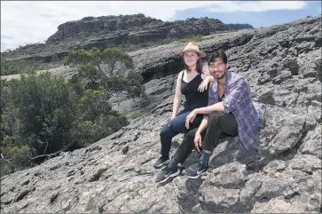  ?? Picture: PAUL CARRACHER ?? POPULAR: Melbourne tourists Lucy Serrett and Shahid Qureshi soak up experience­s at Flat Rock in the northern Grampians last summer. The popular part of the Grampians is near the site of a major resort project.
