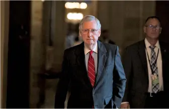  ?? AP FILE PHOTO ?? ‘LEGITIMATE’ PARTICIPAN­T: Senate Majority Leader Mitch McConnell walks to the Senate floor yesterday for a vote on Capitol Hill.